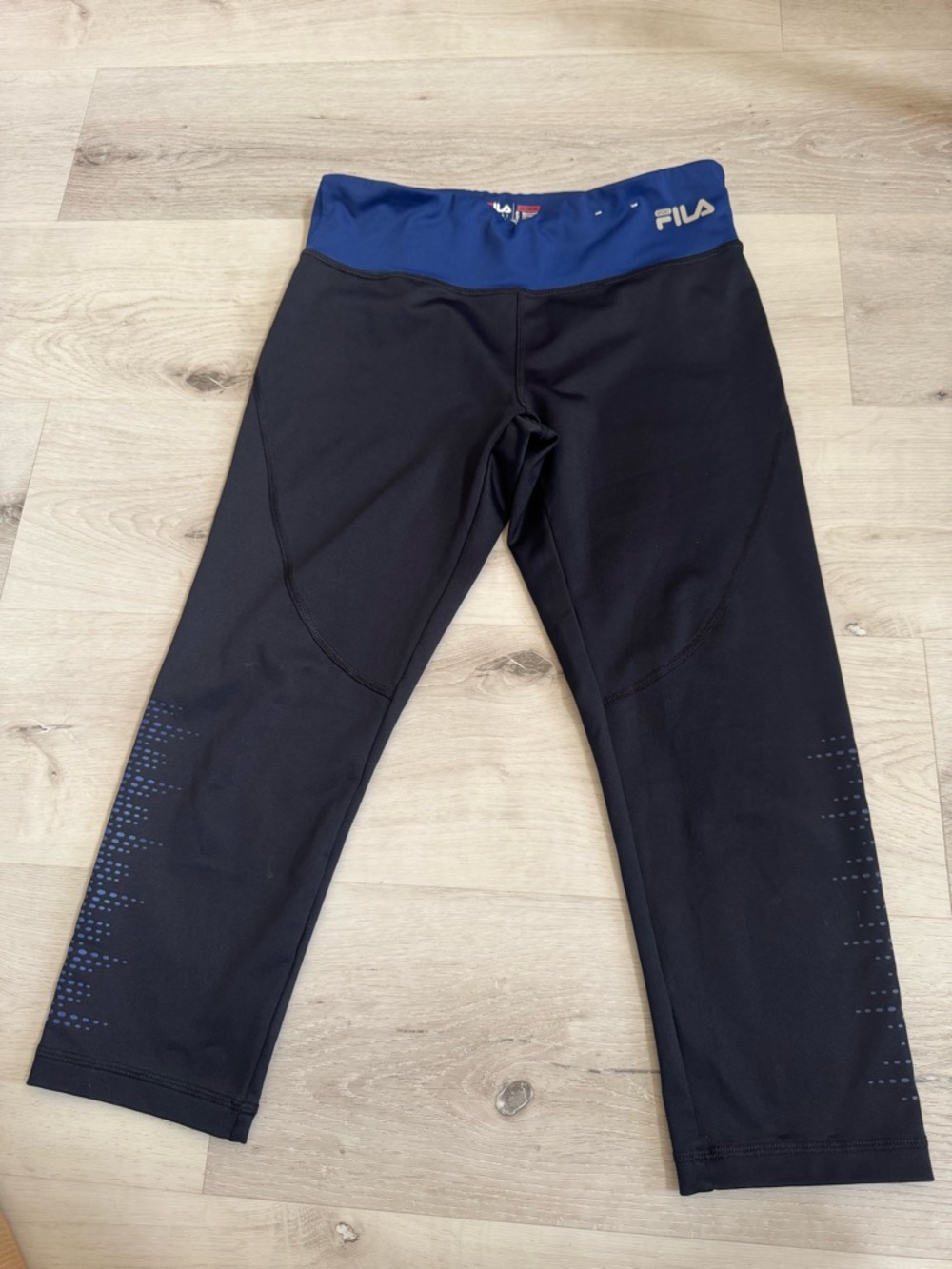 Fila Black Capri Leggings with Blue Waistband and Subtle Dot Accents